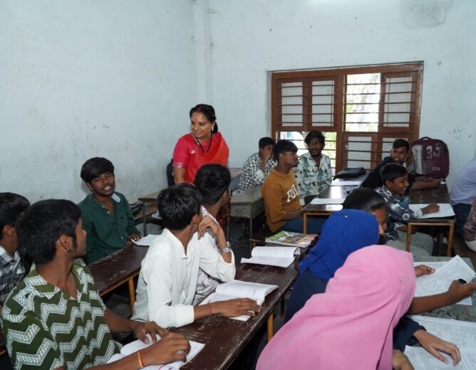 Kalvakuntla Kavitha interacting with students and teachers during her visit to Kacheguda High School in Hyderabad as part of the Jagruti Janambata program