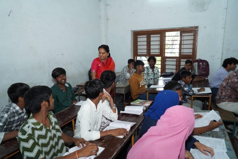 Kalvakuntla Kavitha interacting with students and teachers during her visit to Kacheguda High School in Hyderabad as part of the Jagruti Janambata program