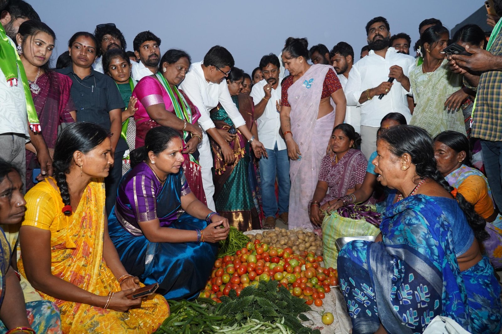 Farmers explaining problems at Suryapet Integrated Vegetable Market to Kavitha